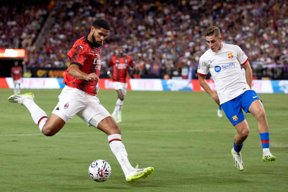 Milan midfielder Ruben Loftus-Cheek (8) attempts a goal while Barcelona forward Fermin Lopez (2 ...