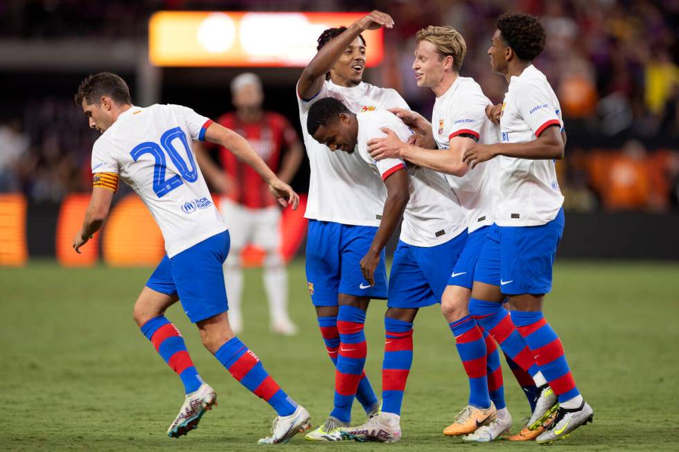 Barcelona rallies around forward Ansu Fati (10) after he scored a goal during the second half o ...