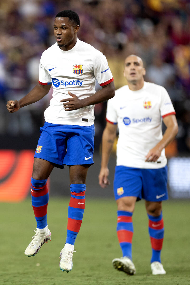 Barcelona forward Ansu Fati (10) celebrates after scoring during the second half of a Soccer Ch ...