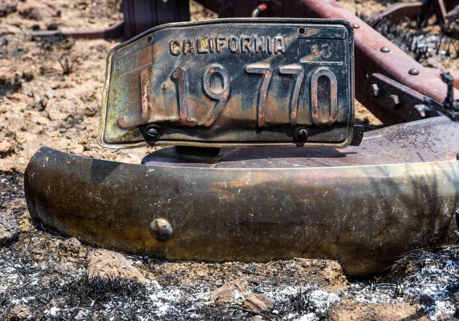 The frame of an old truck is scorched about the desert as the York Fire is better contained alo ...