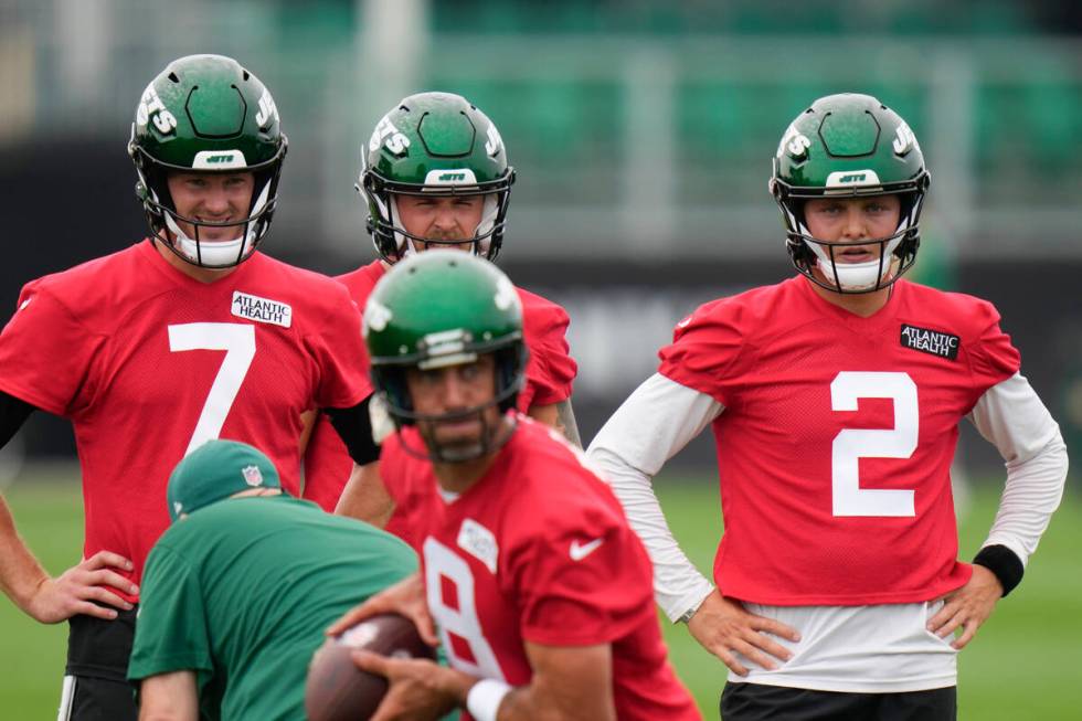 New York Jets quarterbacks Tim Boyle, left, Chris Streveler, center, and Zach Wilson, right, wa ...