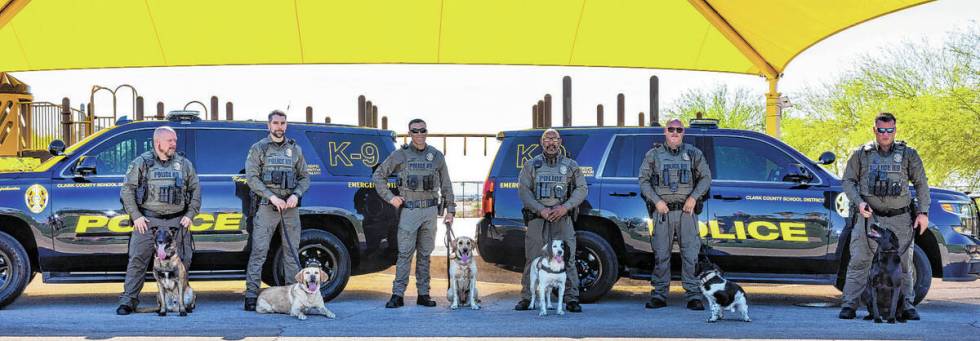 Clark County School District Police Department's K-9 unit officers with their dogs gather for p ...