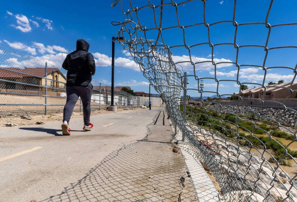 A fence is broken with missing cable atop near where Angel Naranjo recently died from injuries ...