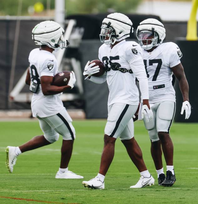 Raiders running back Zamir White (35) goes through a drill with his teammates during training c ...