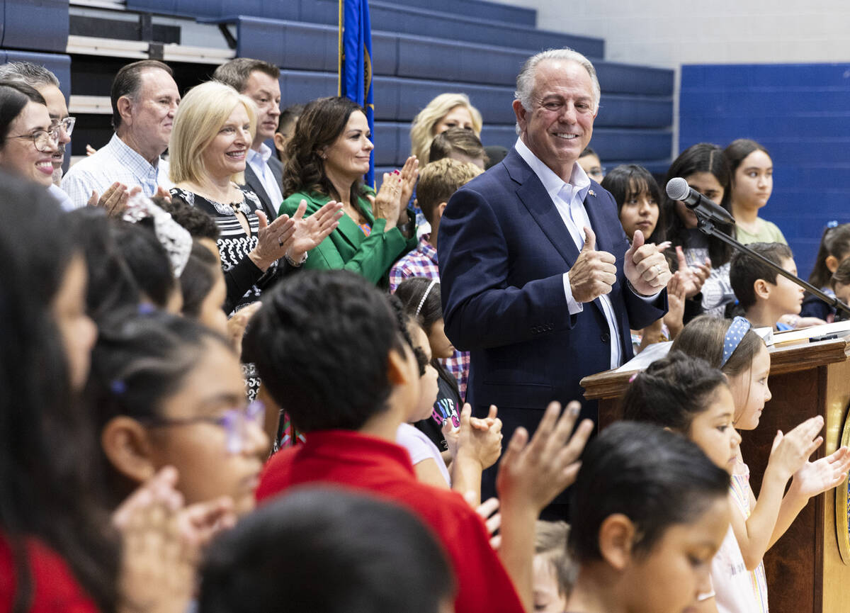 Gov. Joe Lombardo flashes a thumbs-up after speaking during a "school choice" rally at Saint An ...