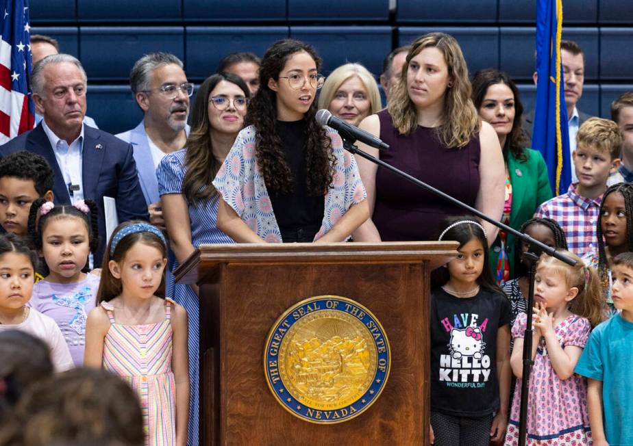 Julia Manzano, one of the Opportunity Scholarship recipients, speaks as Gov. Joe Lombardo, left ...