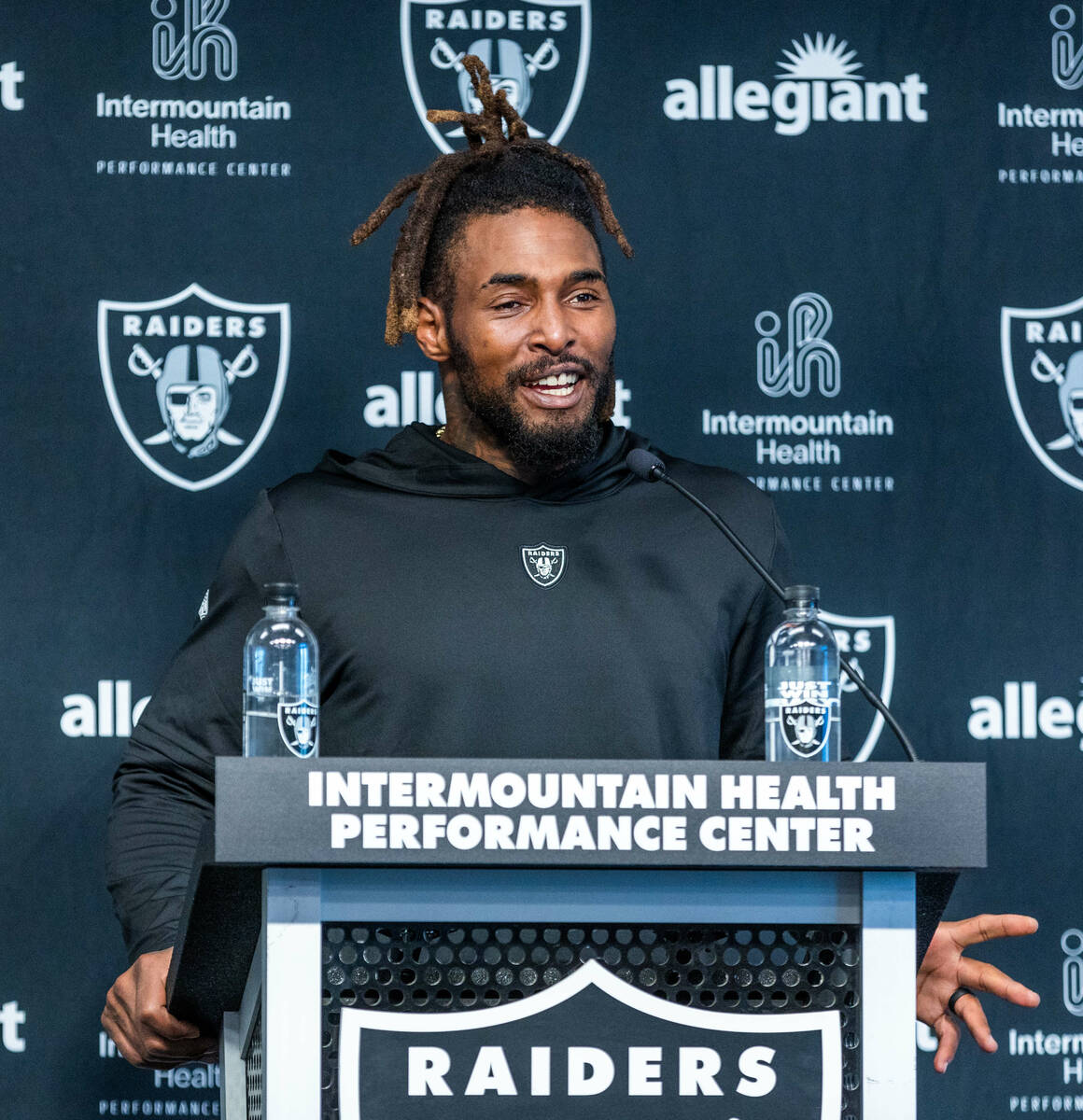 Raiders running back Brandon Bolden (34) answers a question during a press conference in traini ...