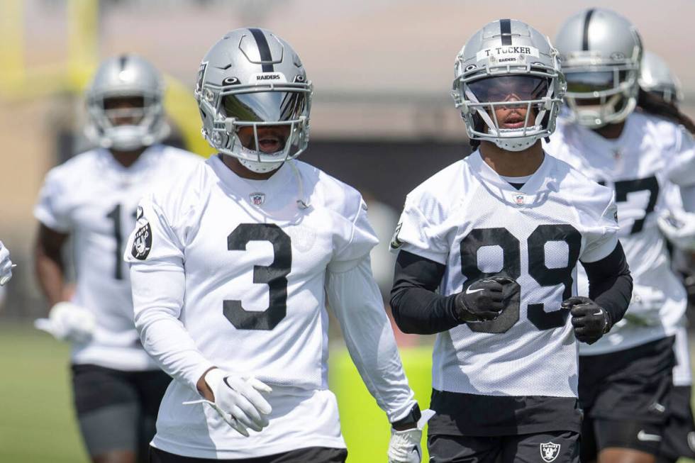 Raiders wide receivers DJ Turner (19), DeAndre Carter (3) and Tre Tucker (89) head to drills du ...