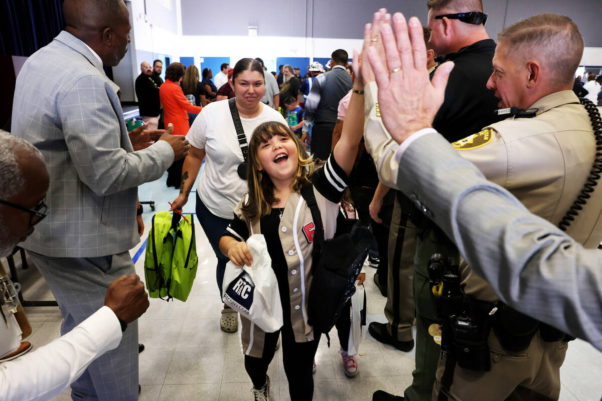 Students, including Genesis Landaverde, 8, walk the red carpet during the annual “Welcom ...