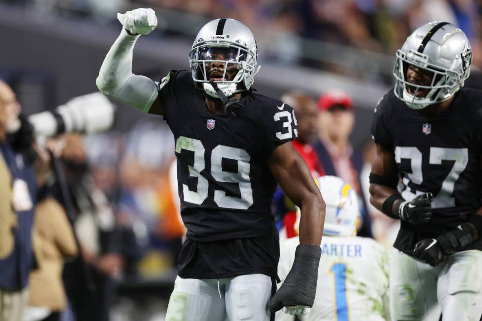 FILE - Raiders cornerback Nate Hobbs (39) with cornerback Sam Webb (27), reacts after defending ...