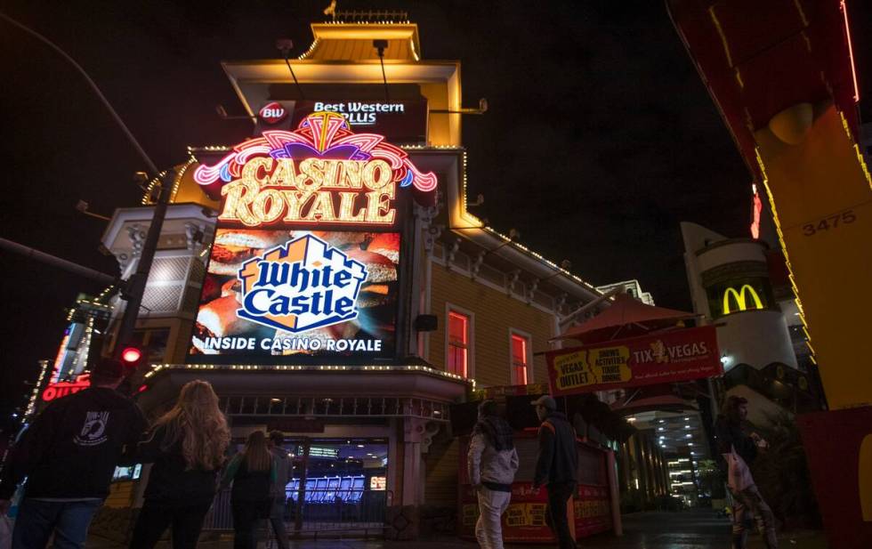 People walk past Casino Royale on the Strip in March 2020 in Las Vegas. (Ellen Schmidt/Las Vega ...