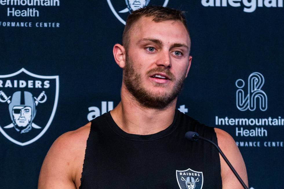 Raiders linebacker Luke Masterson (59) answers a question in a media interview during training ...