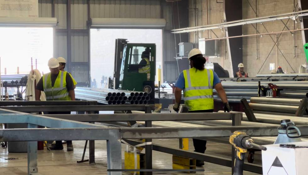 Workers inside the Unimacts manufacturing facility on Monday, Aug. 7, 2023, in Las Vegas. (Sean ...