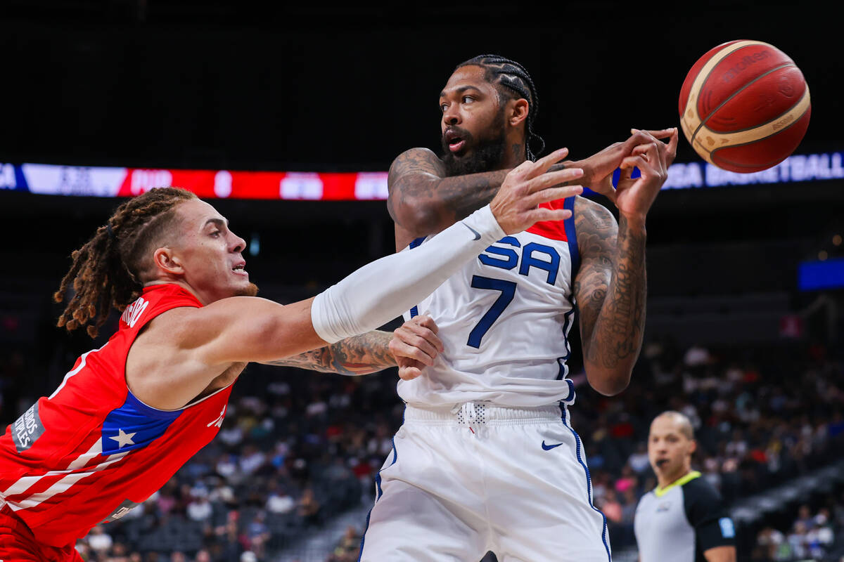 The ball is knocked out of the hands of USA Basketball Men’s National Team forward Brand ...