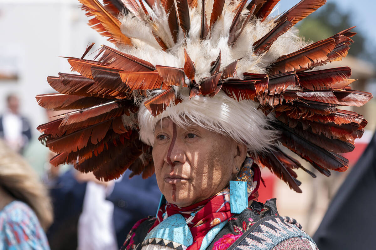 A supporter waits for President Joe Biden to speak and sign a proclamation designating the Baaj ...