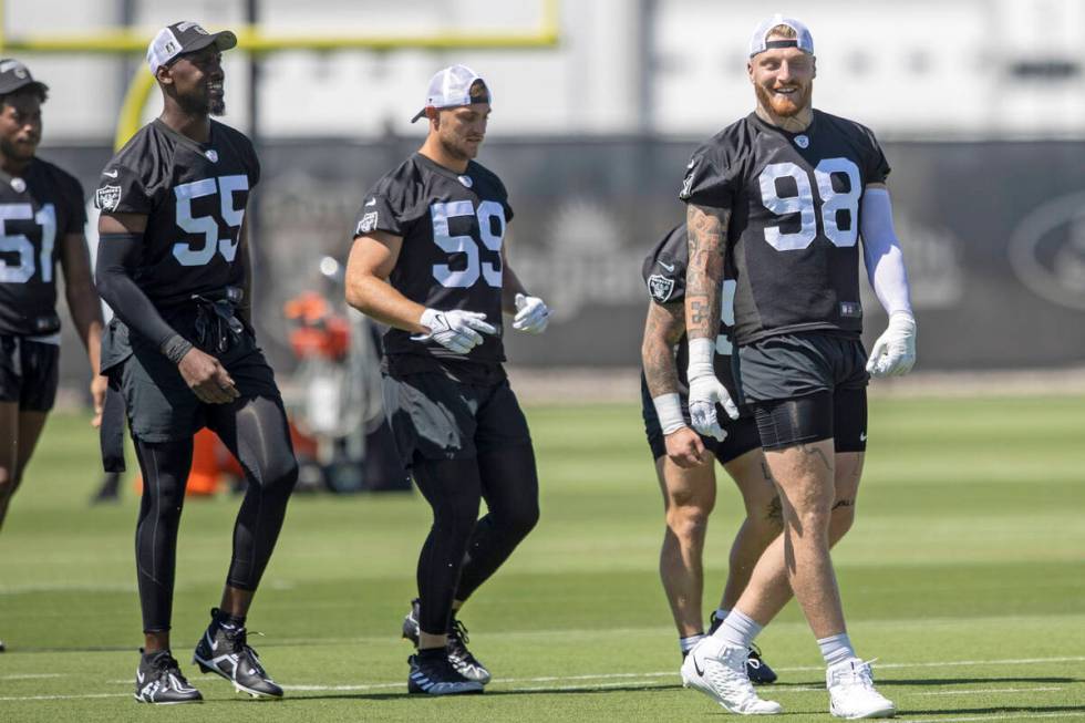 Raiders defensive end Chandler Jones (55), linebacker Luke Masterson (59) and defensive end Max ...