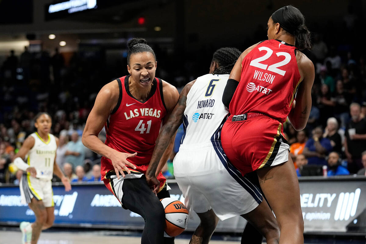 Las Vegas Aces center Kiah Stokes (41) has the ball stripped away by Dallas Wings forward Natas ...