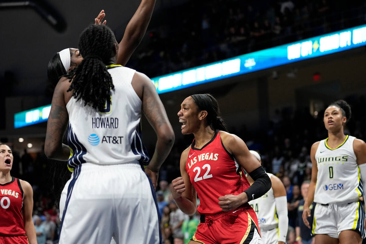 Las Vegas Aces' A'ja Wilson (22) and Kelsey Plum, left, celebrate a basket as Dallas Wings' Nat ...