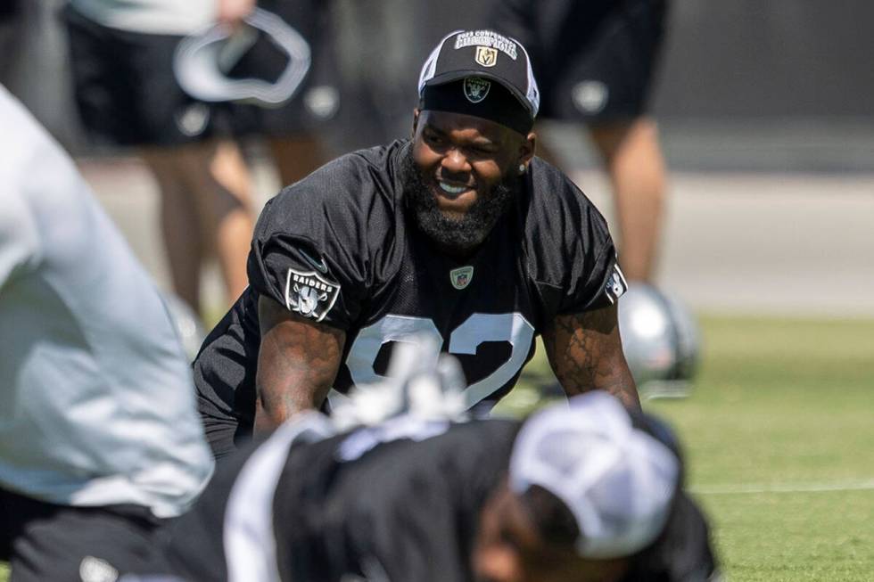 Raiders defensive tackle Neil Farrell Jr. (92) stretches during an organized team activity at I ...