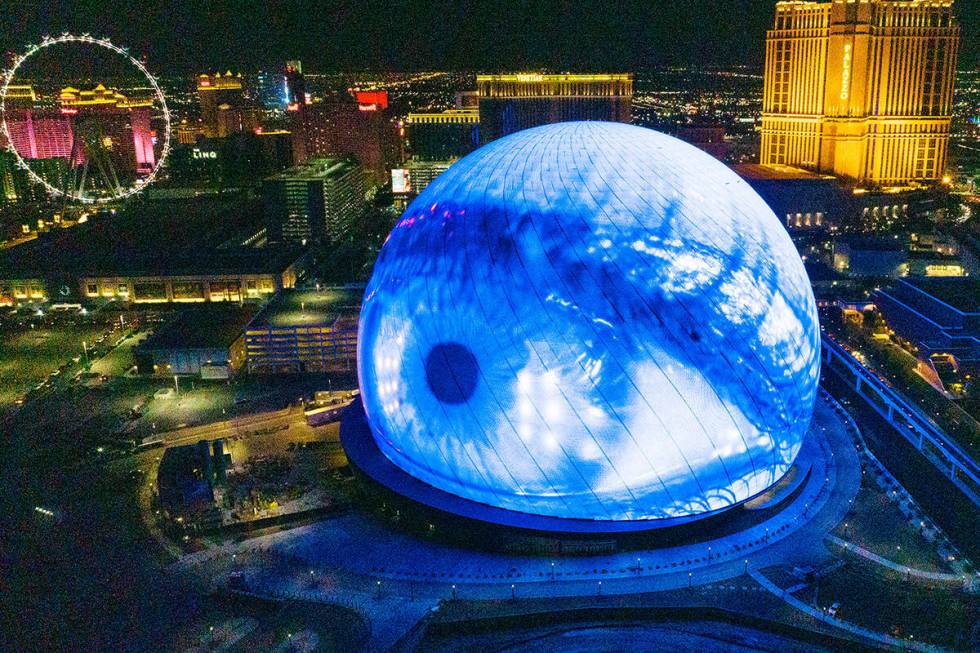 The Sphere illuminates the Las Vegas skyline, on Monday, July 31, 2023, in Las Vegas. (Bizuayeh ...