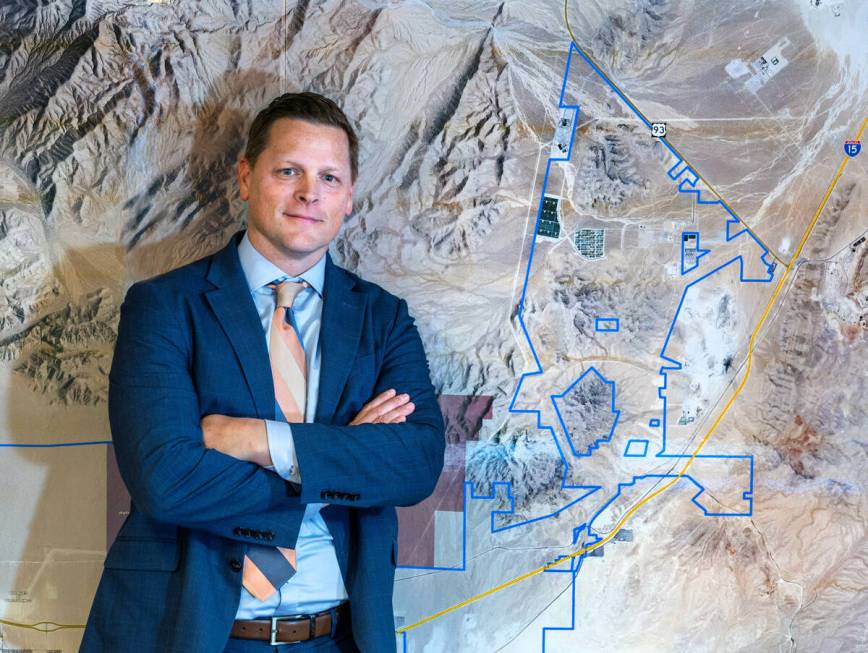 Jared Luke is an economic developer for the City of North Las Vegas with a map of the Apex Indu ...