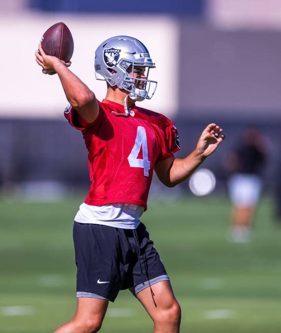 Raiders quarterback Aidan O'Connell (4) sets up to pass during training camp at the Intermounta ...