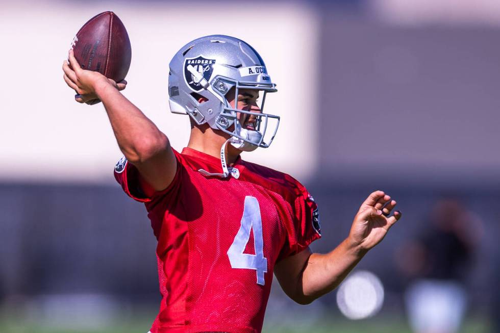 Raiders quarterback Aidan O'Connell (4) sets up to pass during training camp at the Intermounta ...