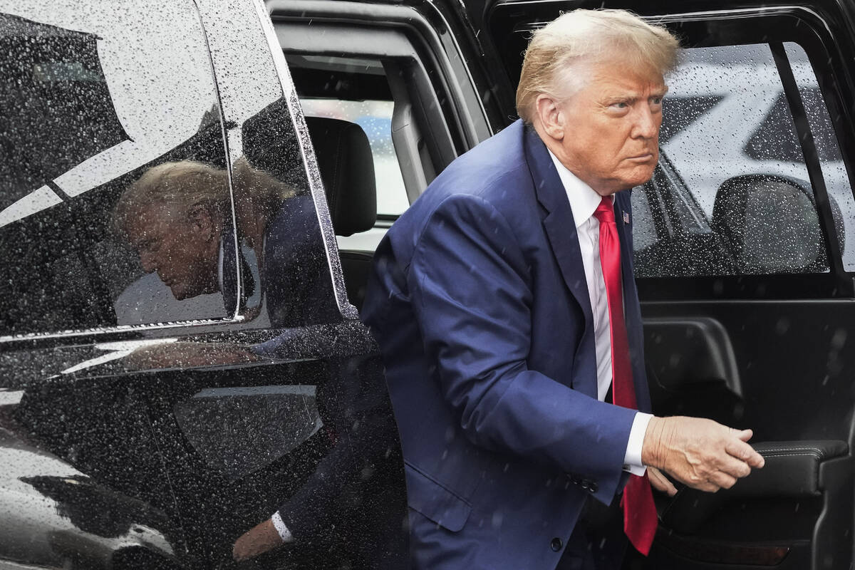 FILE - Former President Donald Trump arrives to board his plane at Ronald Reagan Washington Nat ...