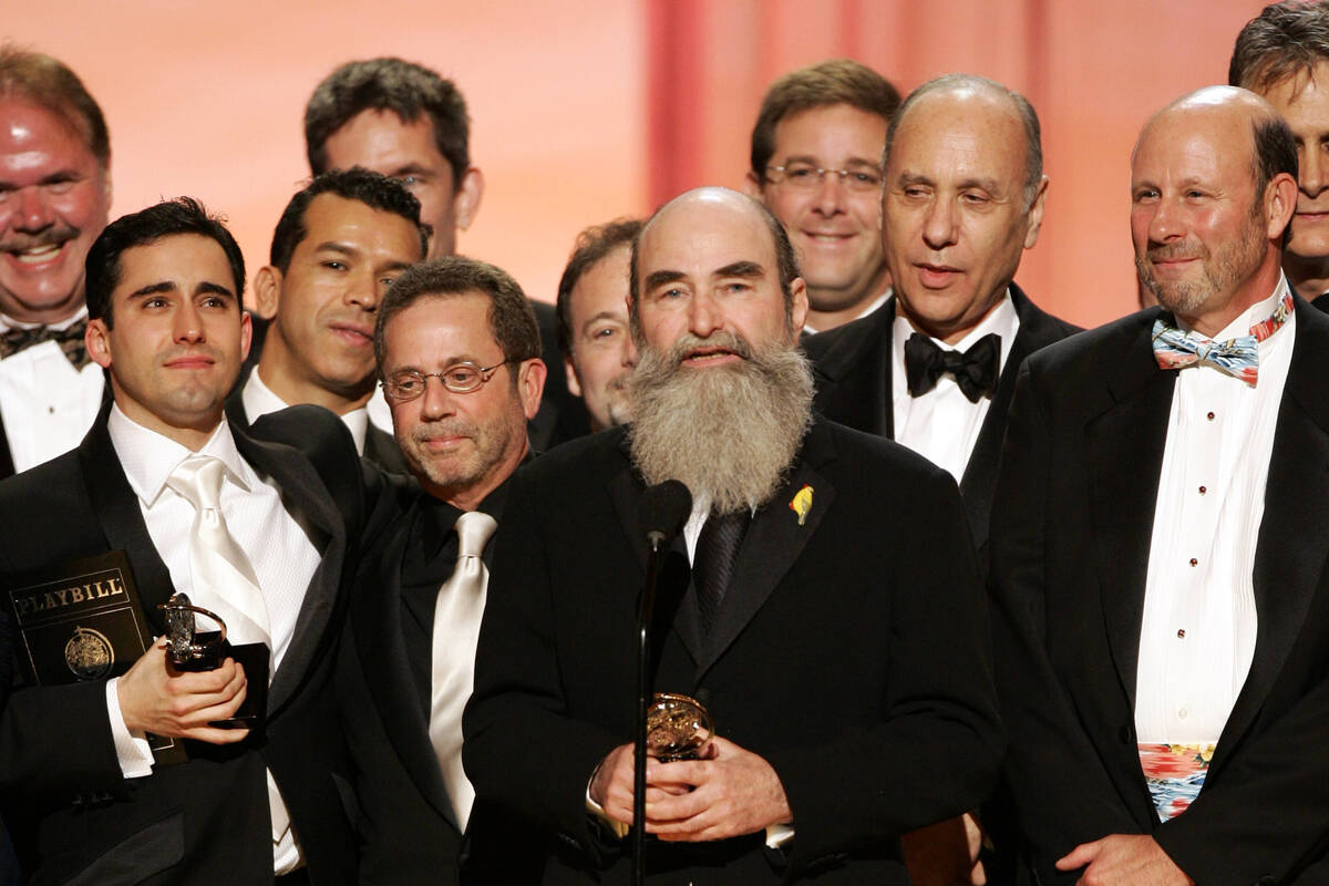 Producer Michael David, center, and other members of the production of "Jersey Boys" accept the ...