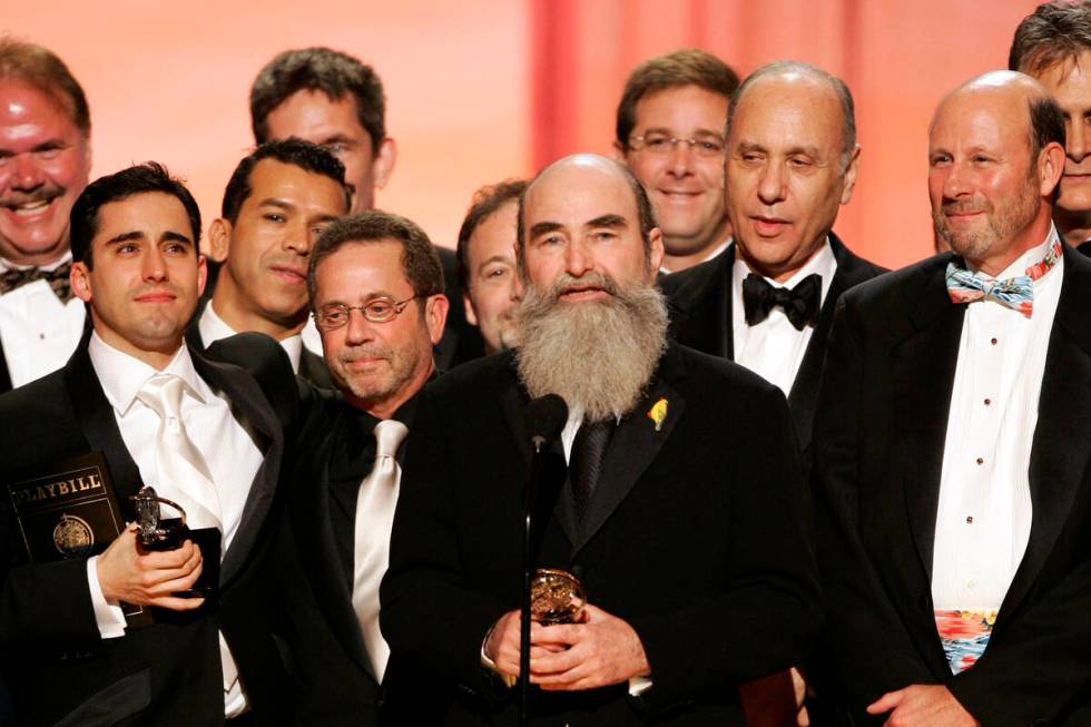 Producer Michael David, center, and other members of the production of "Jersey Boys" accept the ...