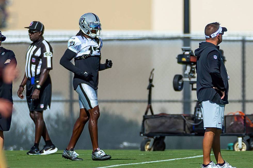 Raiders wide receiver Davante Adams (17) runs on a drill during training camp at the Intermount ...