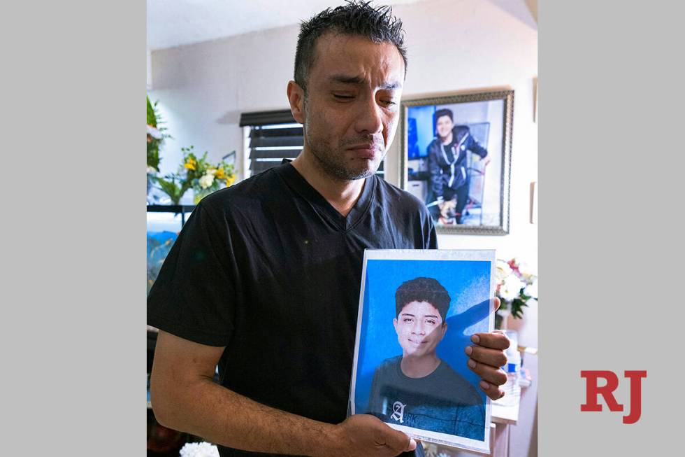 Rudolfo Naranjo holds a photograph of his son, Angel, as he poses for a photo at his Las Vegas ...