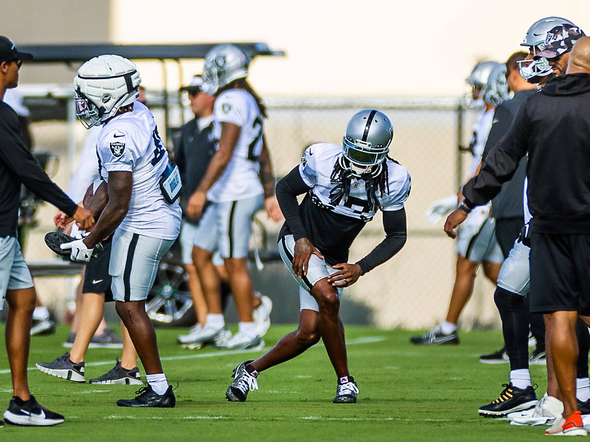 Raiders wide receiver Davante Adams (17) stretches during training camp at the Intermountain He ...