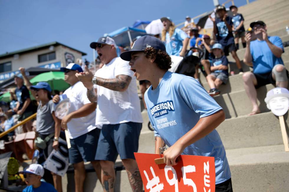 Henderson fans cheer for their team during the Little League West Regional final baseball game ...