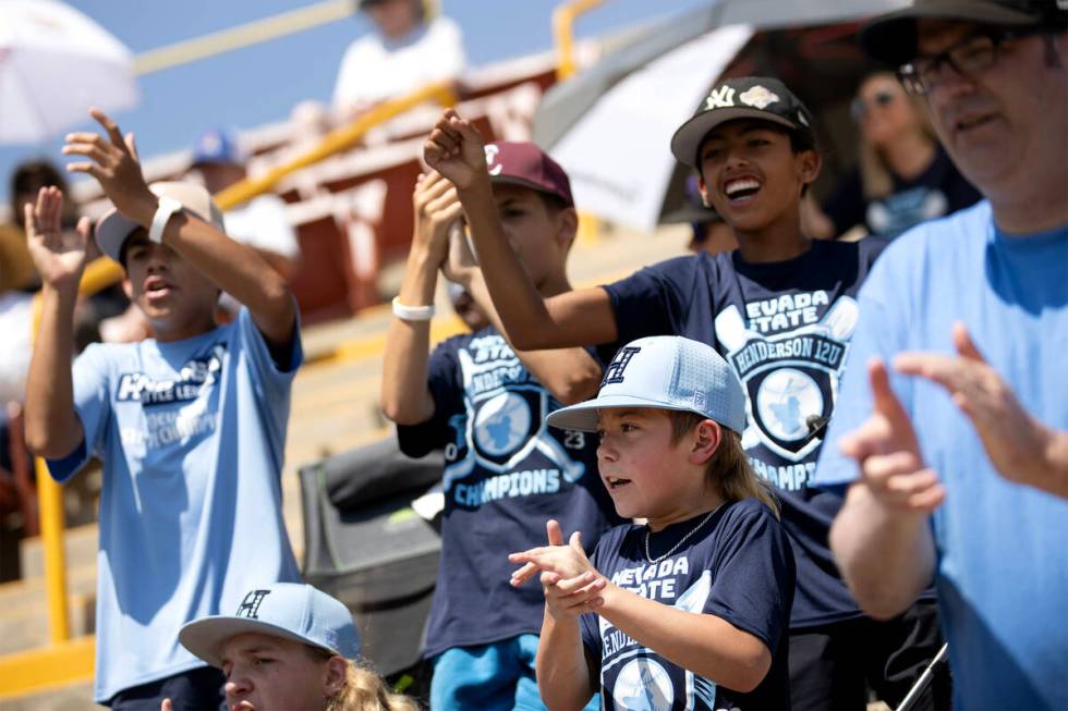 Henderson fans cheer for their team during the Little League West Regional final baseball game ...