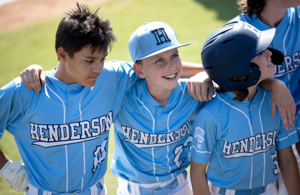 Henderson short stop David Edwards, left, left fielder Mason Walther and right fielder Cruz Les ...