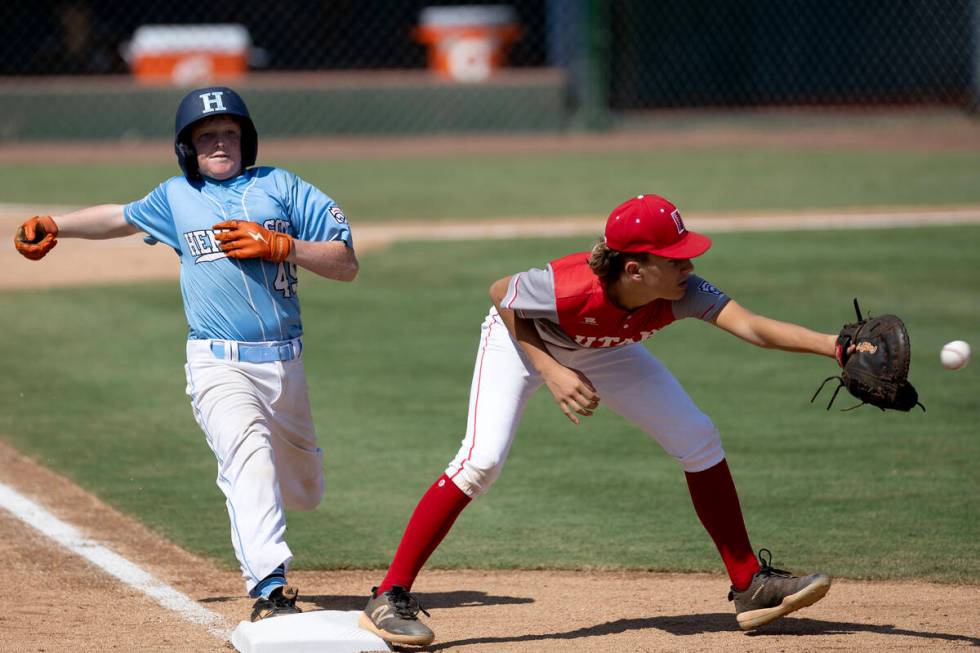 Henderson extra hitter Chase Daley (45) makes it safely to first base while Utah pitcher Brogan ...