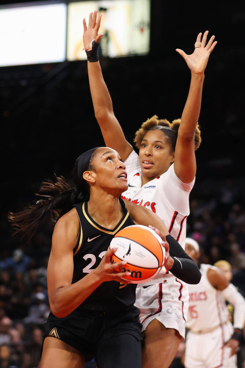 Las Vegas Aces forward A'ja Wilson (22) prepares to take a layup around Washington Mystics forw ...