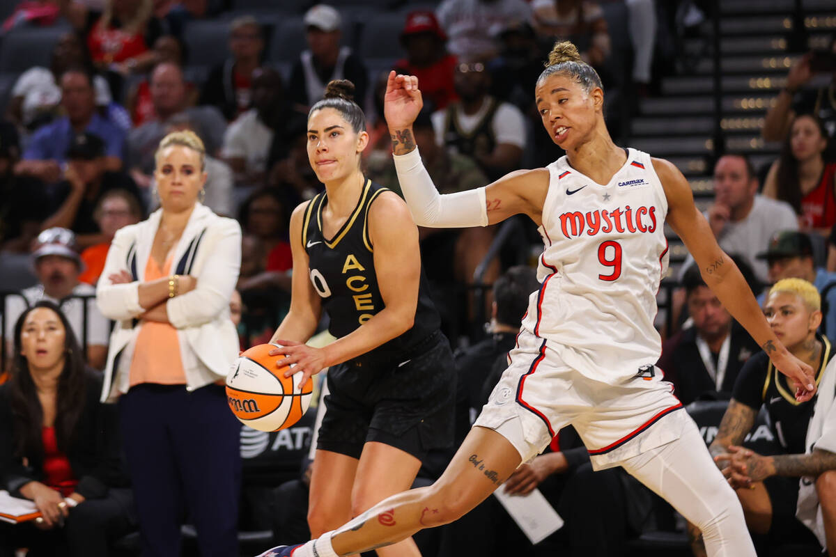 Las Vegas Aces guard Kelsey Plum (10) waits for Washington Mystics guard Natasha Cloud (9) to r ...