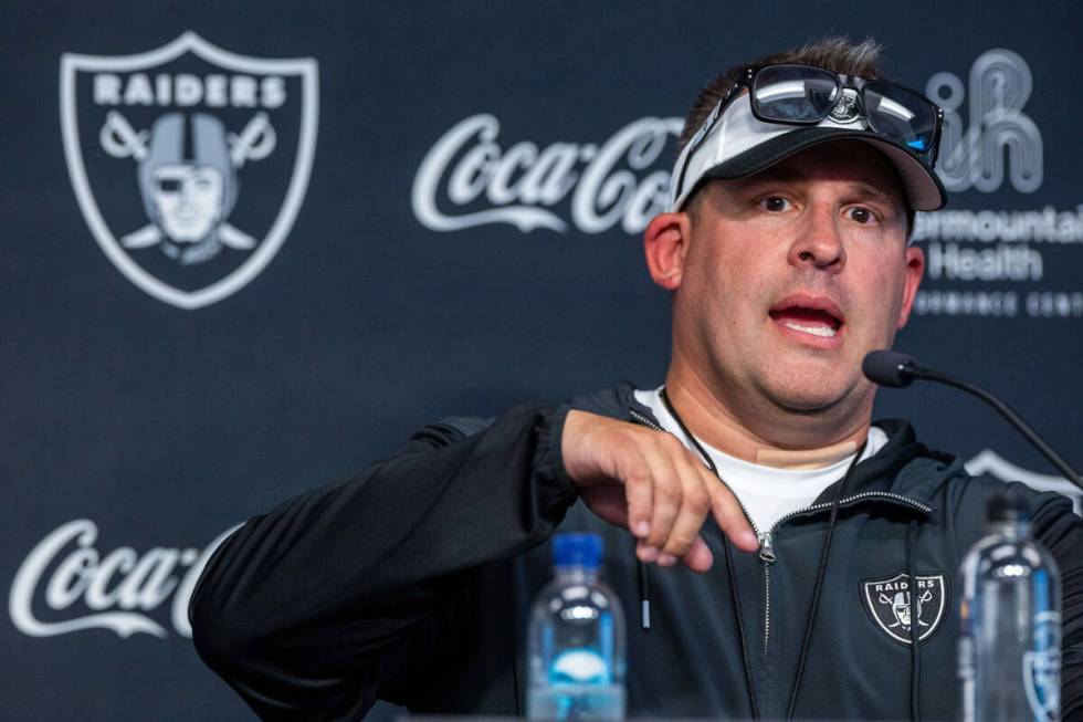 Raiders head coach Josh McDaniels answers a question in a press conference during training camp ...