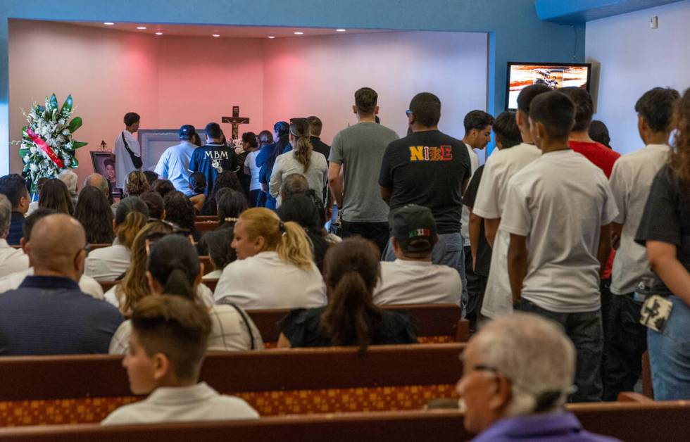 Mourners line up to say their final goodbyes during funeral services for Angel Naranjo at Palm ...