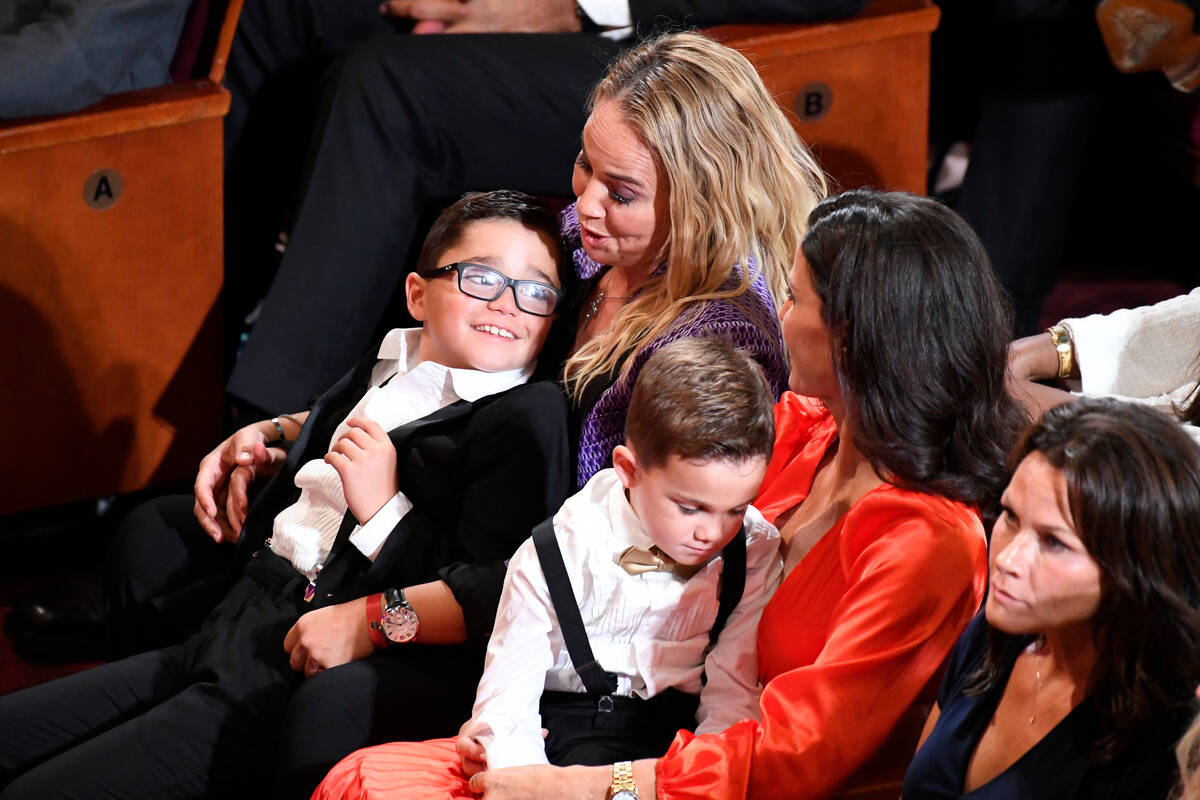 Becky Hammon, top left, sits with her family during the Basketball Hall of Fame enshrinement ce ...