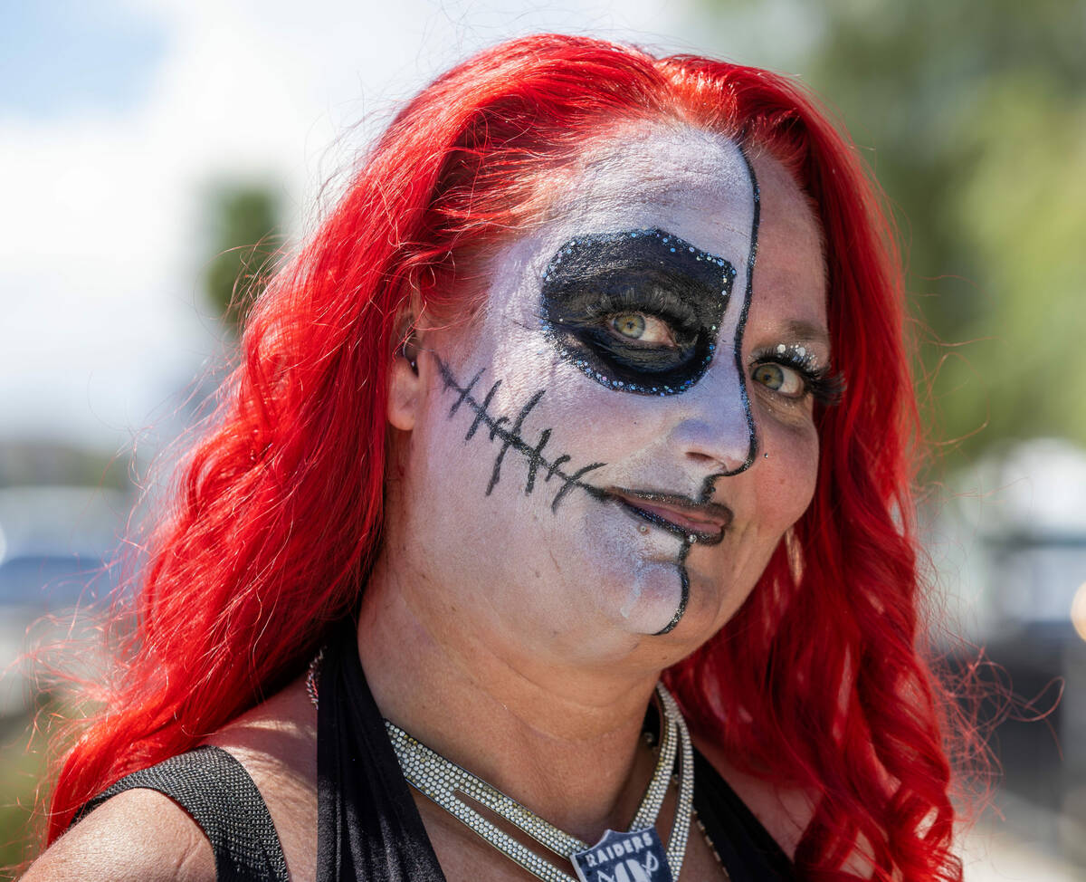 A Raiders fan is ready for the action before the first preseason NFL game at Allegiant Stadium ...