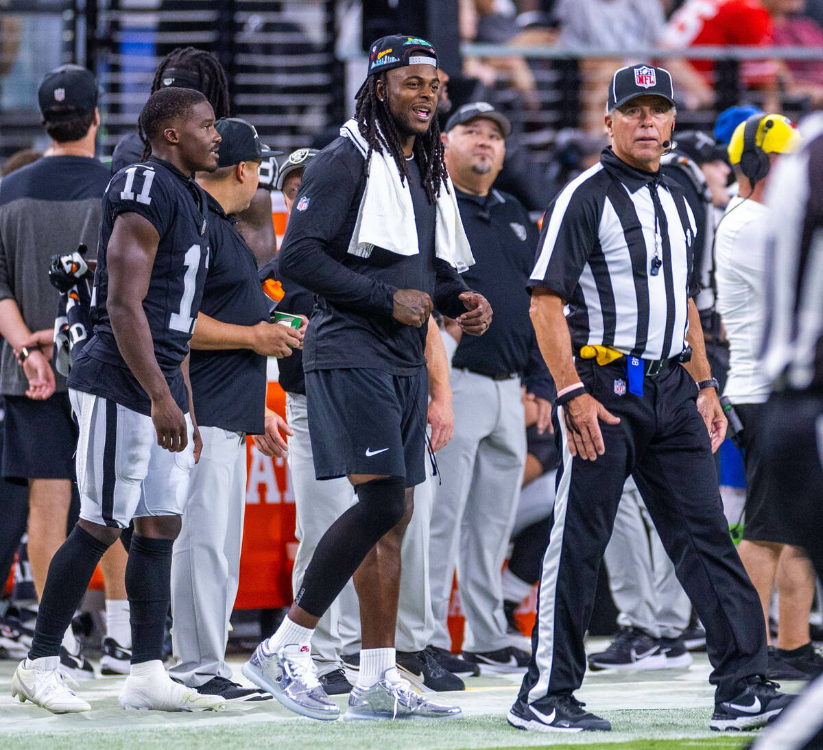 Raiders wide receiver Davante Adams (17) talks with an official on a play review against the Sa ...