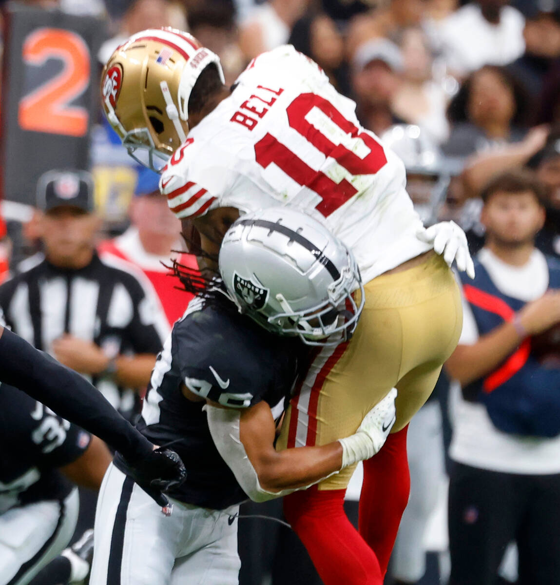 Raiders cornerback Bryce Cosby (44) tackles the San Francisco 49ers wide receiver Ronnie Bell ( ...