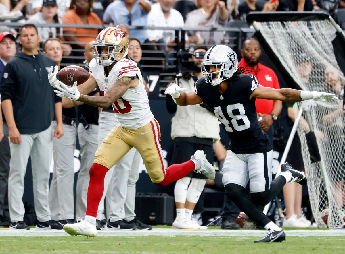The San Francisco 49ers wide receiver Ronnie Bell (10) catches a pass as Raiders cornerback Azi ...