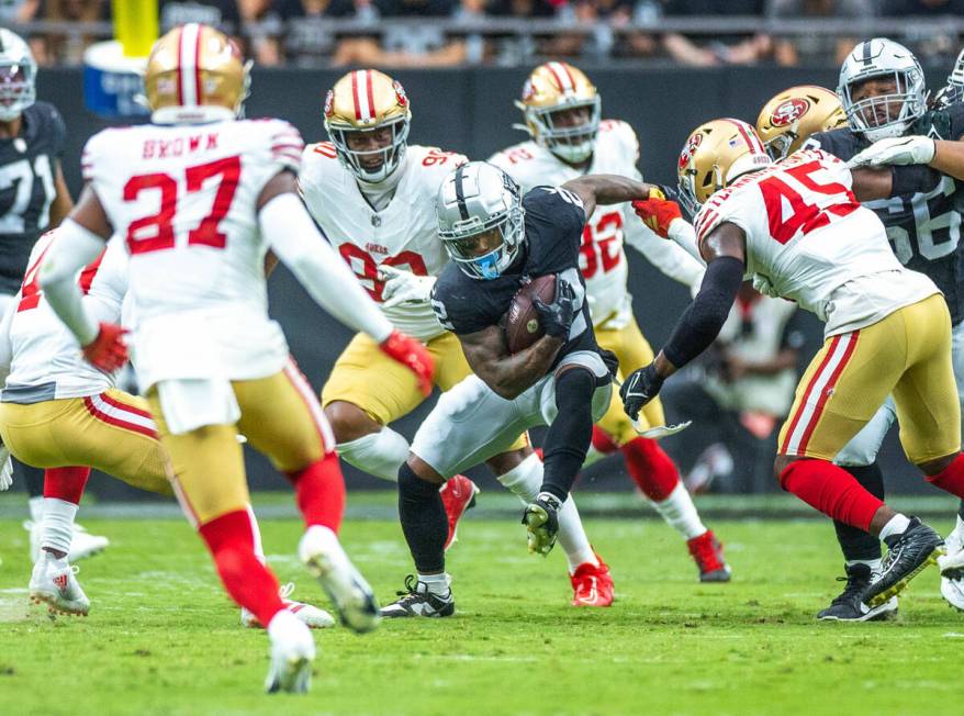 Raiders running back Ameer Abdullah (22) looks to evade San Francisco 49ers linebacker Demetriu ...