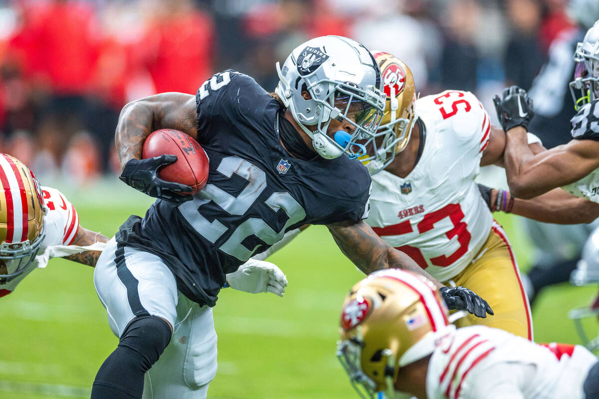 Raiders running back Ameer Abdullah (22) moves past San Francisco 49ers linebacker Dee Winters ...