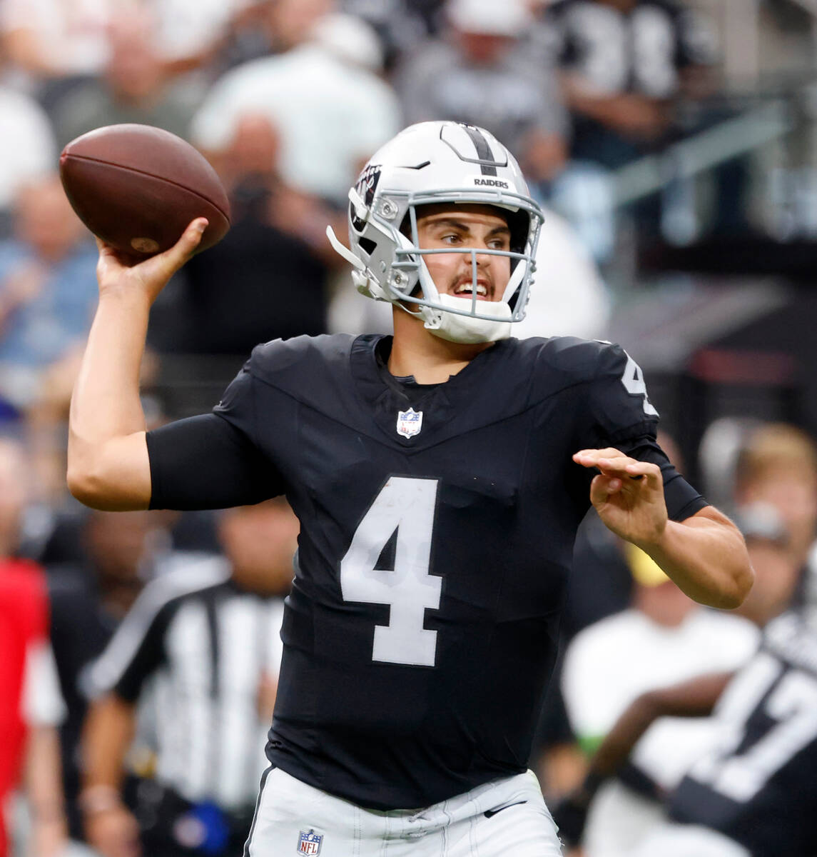 Raiders quarterback Aidan O'Connell (4) throws a pass during the second half of an NFL preseaso ...