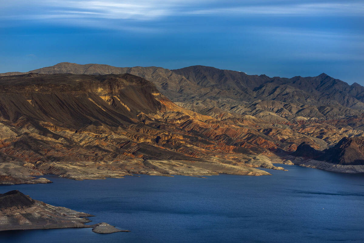 The Fortification Hill area catches the late-day light above the receding Lake Mead shoreline o ...
